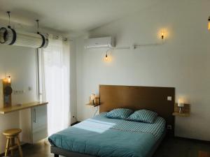 Cama o camas de una habitación en Gite Blanco y Madera