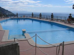 a large swimming pool on top of a building at Casa Amore Positano in Positano