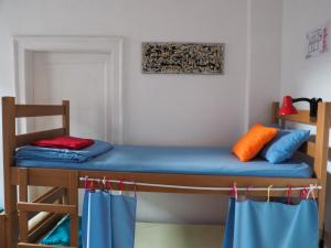 En eller flere senge i et værelse på Hostel El Diablo