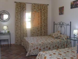 Postel nebo postele na pokoji v ubytování Hostal El Canario