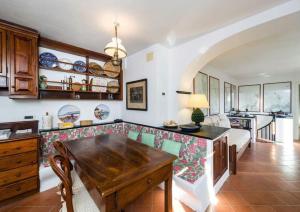 a kitchen with a wooden table in a room at Cottage san Michele in Rapallo