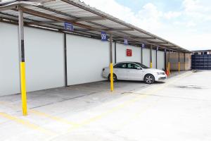 a car is parked in a parking lot at Hotel Flor de Liz in Guayaquil