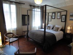 מיטה או מיטות בחדר ב-B&B A La Maison Blanche