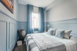 Letto o letti in una camera di Petronio Residence
