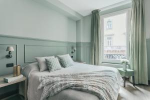 Letto o letti in una camera di Petronio Residence