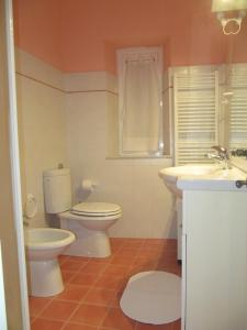 a bathroom with a toilet and a sink at La Casa dell ' Orto in Lerici +10 photos