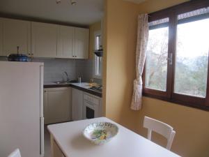a kitchen with a table and a bowl on the table at La Casa dell ' Orto in Lerici