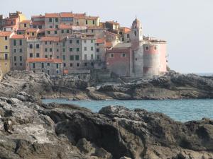 a group of buildings on top of a rocky island at La Casa dell ' Orto in Lerici