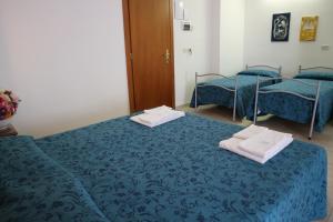 Voodi või voodid majutusasutuse Hotel Orchidea toas
