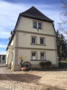 a house with a flower in front of it at Pension Schackstedt in Schackstedt