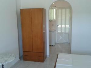 Postel nebo postele na pokoji v ubytování Rallou Rooms & Apartments