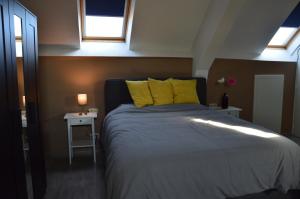 Un pat sau paturi într-o cameră la Vakantiehuis Jeanne Panne