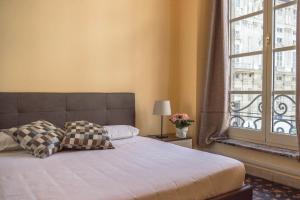 Posteľ alebo postele v izbe v ubytovaní Nunziata Apartment