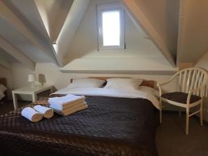 Cama o camas de una habitación en Apartamentai Upė