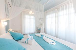 Katil atau katil-katil dalam bilik di Alura Hotel