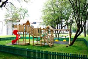 a park with a playground with a slide at Pravets Resort Apartments in Pravets