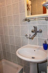 a bathroom with a sink and a mirror at Apartment Dijana in Petrovac na Moru