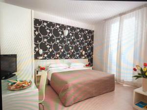 Postel nebo postele na pokoji v ubytování Hotel Stella Polare