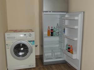 a washing machine and a washer in a room at Vacation Home Gela in Batumi