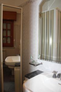 a bathroom with a sink and a mirror at La casa di Bia in Corleone +33 photos