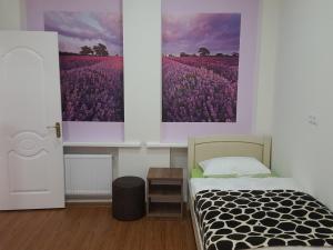 a bedroom with a bed and a field of purple flowers at Holiday Home in Old Tbilisi in Tbilisi City +54 photos