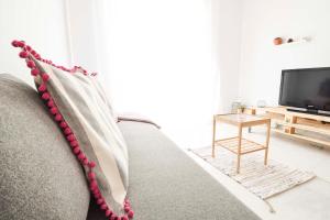Televízia a/alebo spoločenská miestnosť v ubytovaní P&P Apartaments Carrera de Capuchinos