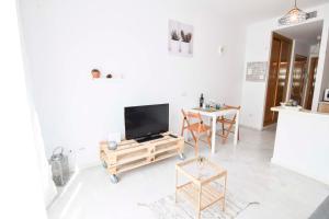 Televízia a/alebo spoločenská miestnosť v ubytovaní P&P Apartaments Carrera de Capuchinos