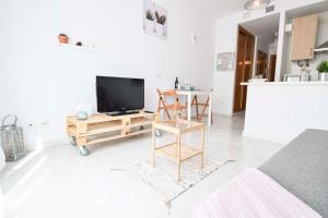 Televízia a/alebo spoločenská miestnosť v ubytovaní P&P Apartaments Carrera de Capuchinos