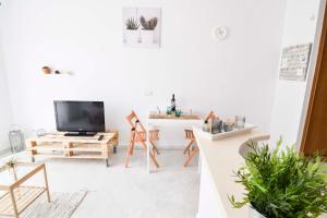 Televízia a/alebo spoločenská miestnosť v ubytovaní P&P Apartaments Carrera de Capuchinos