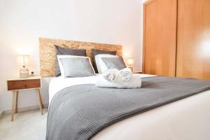 Posteľ alebo postele v izbe v ubytovaní P&P Apartaments Carrera de Capuchinos