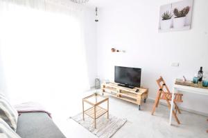 Televízia a/alebo spoločenská miestnosť v ubytovaní P&P Apartaments Carrera de Capuchinos
