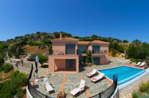 an image of a villa with a swimming pool at Villa Alkionis in Skala