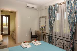 Postel nebo postele na pokoji v ubytování Klisouri Beach Villa