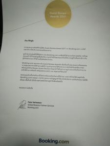 een envelop met een document erop bij Deva Garden Resort in Prachin Buri