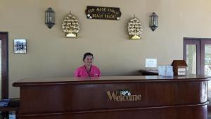 a woman standing behind a counter at a hair salon at Koh Mook Sivalai Beach Resort in Koh Mook +166 photos