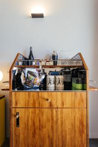 
a wooden shelf with various items on top of it at MACq 01 Hotel in Hobart
