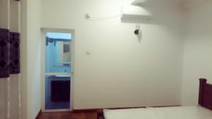 Postel nebo postele na pokoji v ubytování Himawari Beach Villa
