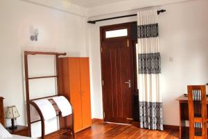 Postel nebo postele na pokoji v ubytování Himawari Beach Villa