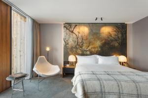 Postel nebo postele na pokoji v ubytování MACq 01 Hotel