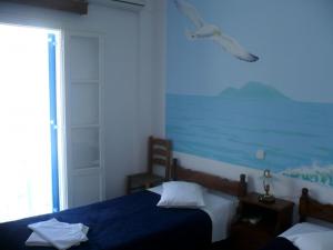 Posteľ alebo postele v izbe v ubytovaní Poseidon Studios
