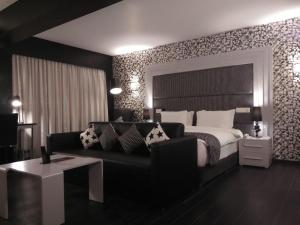Postel nebo postele na pokoji v ubytování Hotel Oxina Lygon