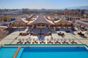 an overhead view of a hotel with a pool and tents at Salalah Gardens Hotel Managed by Safir Hotels & Resorts in Salalah