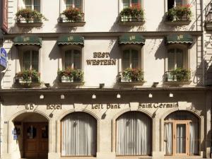 a building with flowerpots on the side of it at Hotel Left Bank Saint Germain in Paris