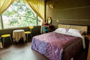 Postelja oz. postelje v sobi nastanitve Ruyi Yuan Homestay