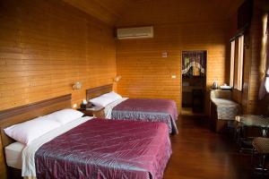 Postelja oz. postelje v sobi nastanitve Ruyi Yuan Homestay