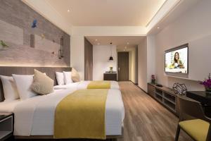 Katil atau katil-katil dalam bilik di Citadines Gaoxin Xi'an