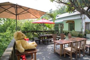 Vrt pred nastanitvijo Ruyi Yuan Homestay + 11 fotografij