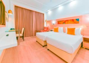 Säng eller sängar i ett rum på Lemon Tree Hotel Jammu