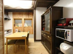 Kuchyň nebo kuchyňský kout v ubytování Iwamura Guest House Yanagiya