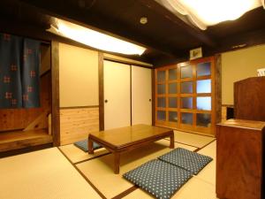 Postel nebo postele na pokoji v ubytování Iwamura Guest House Yanagiya